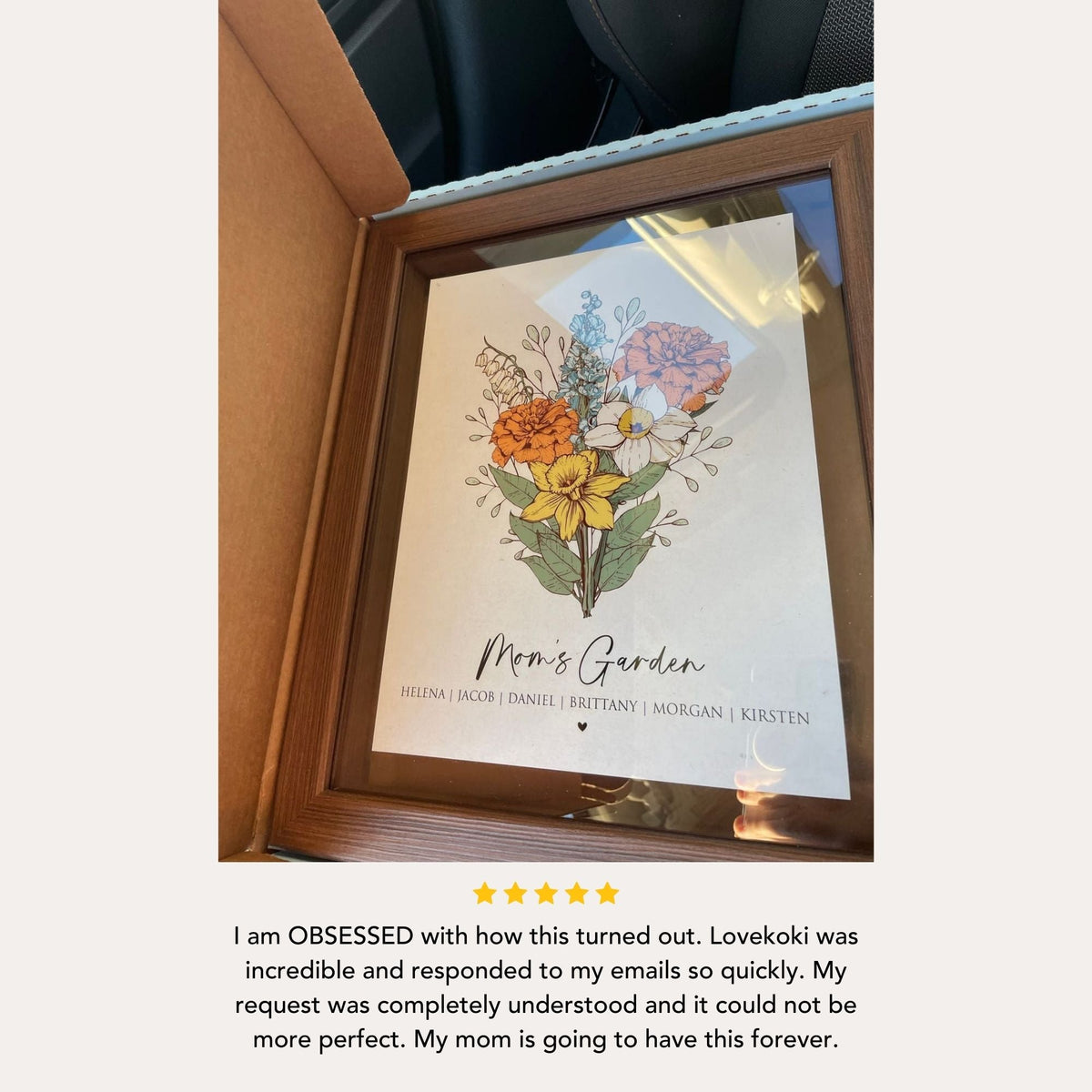 a picture of flowers in a wooden frame